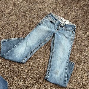 Ariat boot cut jeans. Size 28 short. Small stain on leg.
